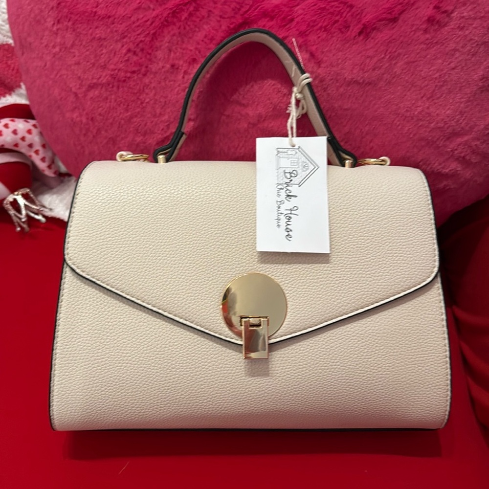 Cream purse with gold hardware